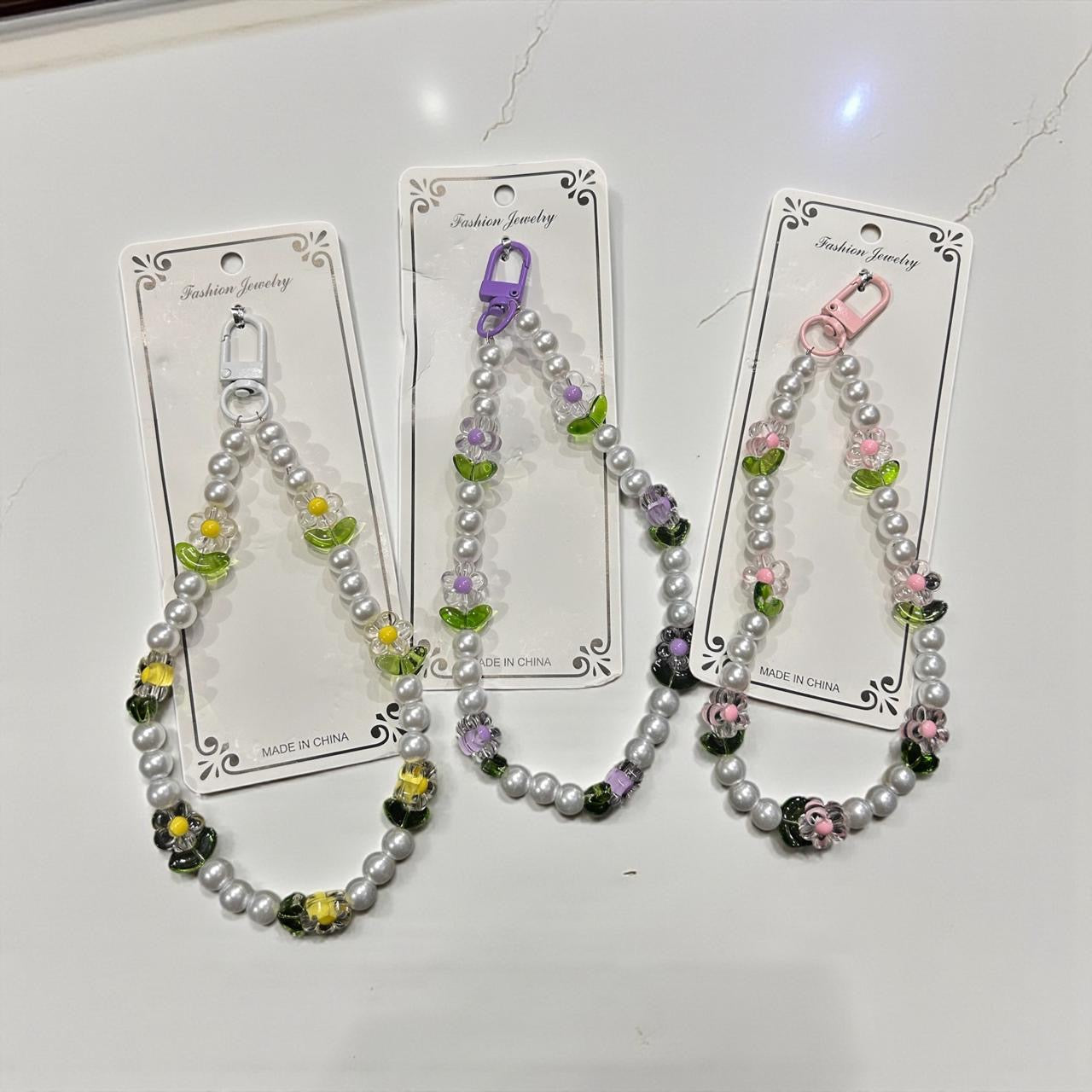 Pearl Flower Phone Charm – Elegant Beaded Mobile Strap for Girls & Women
( pack of 12)