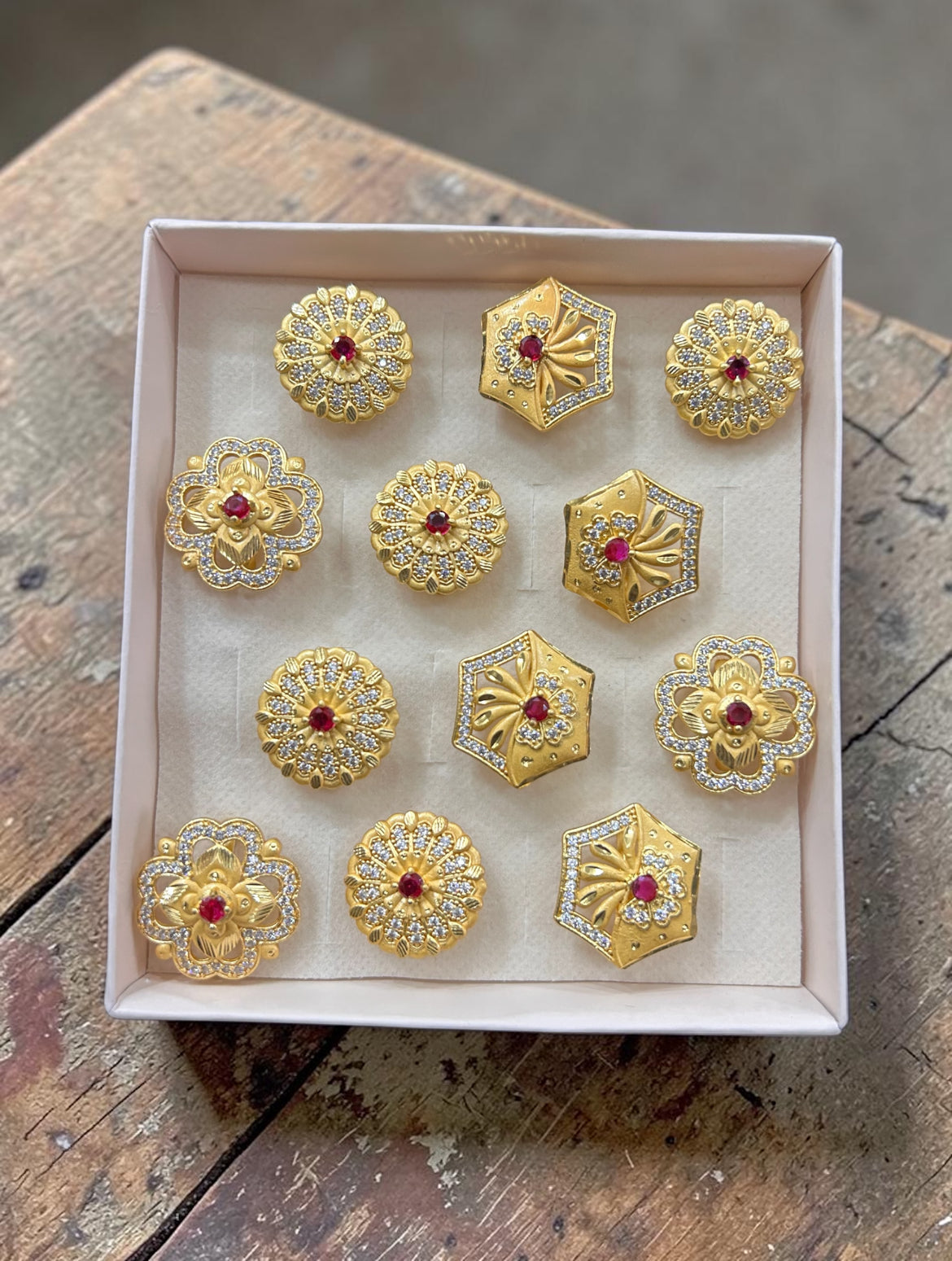 Premium 1 Gram Gold Polish Floral & Geometric Ruby Stone Rings Set for Women – Designer Artificial Jewellery Collection(pack of 12)
