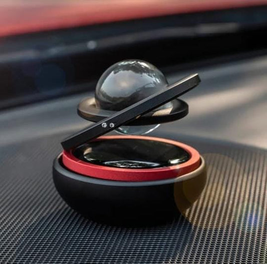 Solar power revolving car stand with fragrance